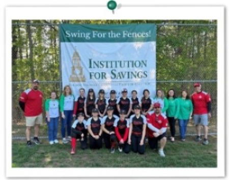 Team photo of Middleton Softball Team in front of large Institution for Savings baseball banner